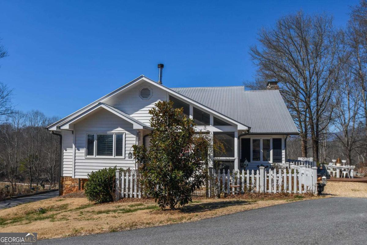 708 Hub Tatum Road Sautee Nacoochee, GA 30571 - Photo 97 of 100 a front view of a house with a yard