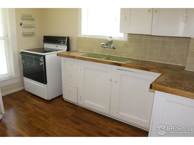 a utility room with sink dryer and washer