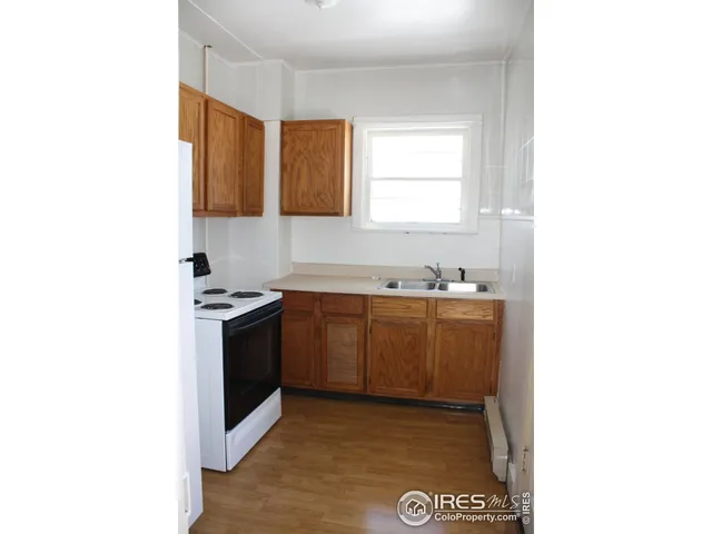 a kitchen with a sink and a stove