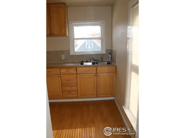 a view of a bathroom with a sink and a window