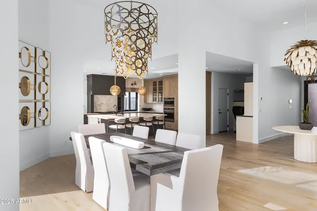 a large kitchen with a table and chairs
