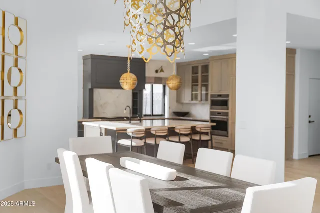a kitchen with a table and chairs in it