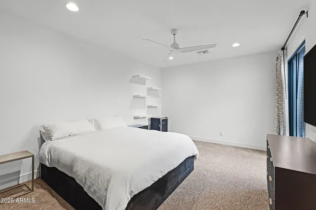 a bathroom with a tub shower and sink