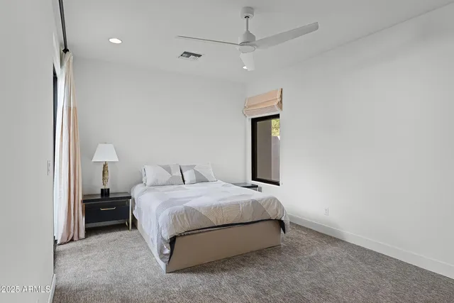 a view of hallway with stairs and wooden floor