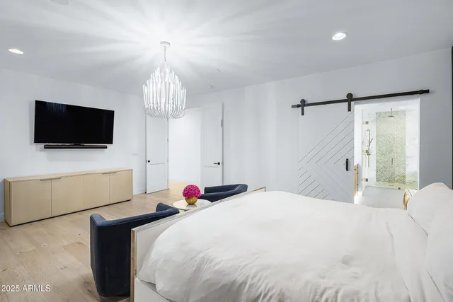a kitchen with a table chairs sink and cabinets