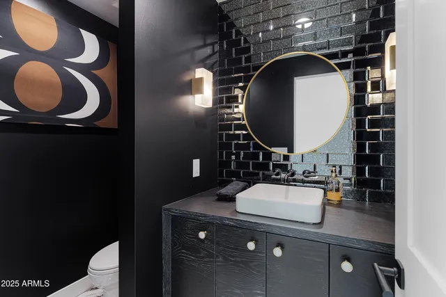 a kitchen with a stove and a wooden cabinets