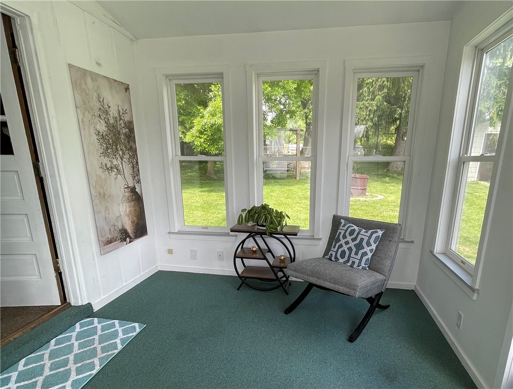 360 Ridge Street Piqua, OH 45356 - Photo 32 of 46 This bright sunroom offers verdant views, creating a serene and inviting retreat.