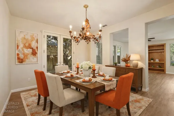 a large kitchen with kitchen island granite countertop a large window in it