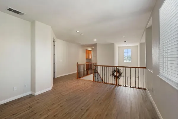 a white bath tub sitting in a bathroom next to a window