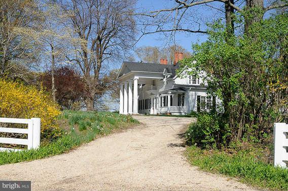 1059 Cumberstone Road Harwood, MD 20776 - Photo 2 of 26 a front view of a house with a garden