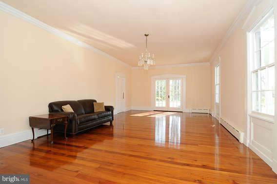 1059 Cumberstone Road Harwood, MD 20776 - Photo 12 of 26 a living room with furniture window and wooden floor