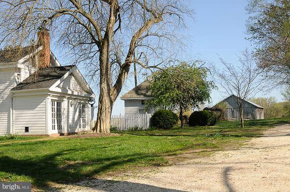 1059 Cumberstone Road Harwood, MD 20776 - Photo 4 of 26 a front view of a house with a yard