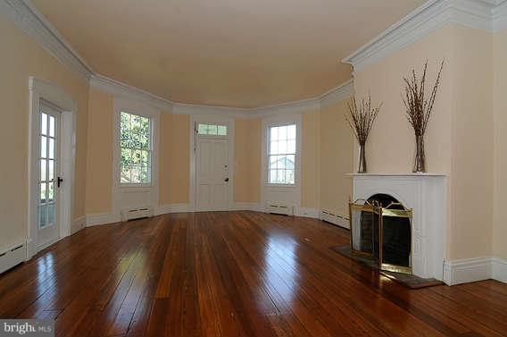 1059 Cumberstone Road Harwood, MD 20776 - Photo 7 of 26 an empty room with wooden floor and windows