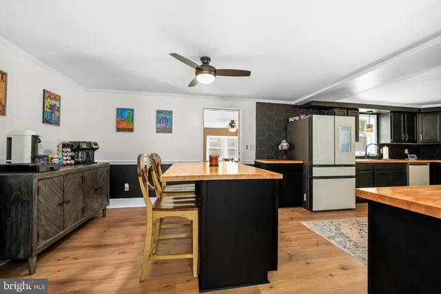 a kitchen with granite countertop stainless steel appliances and wooden cabinets