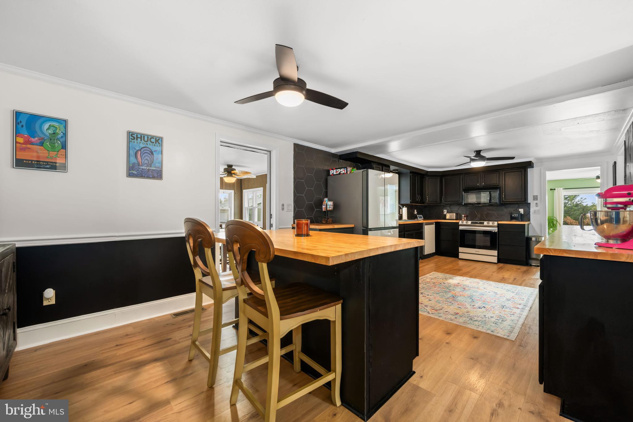 7653 Broad Neck Road Chestertown, MD 21620 - Photo 19 of 39 a view of a dining room with furniture and wooden floor