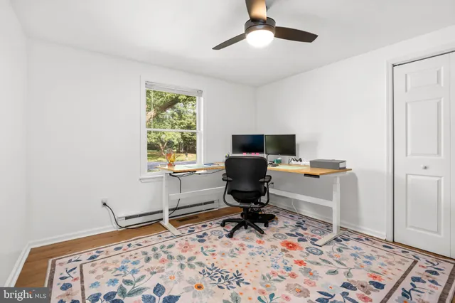 a view of an entryway with wooden floor