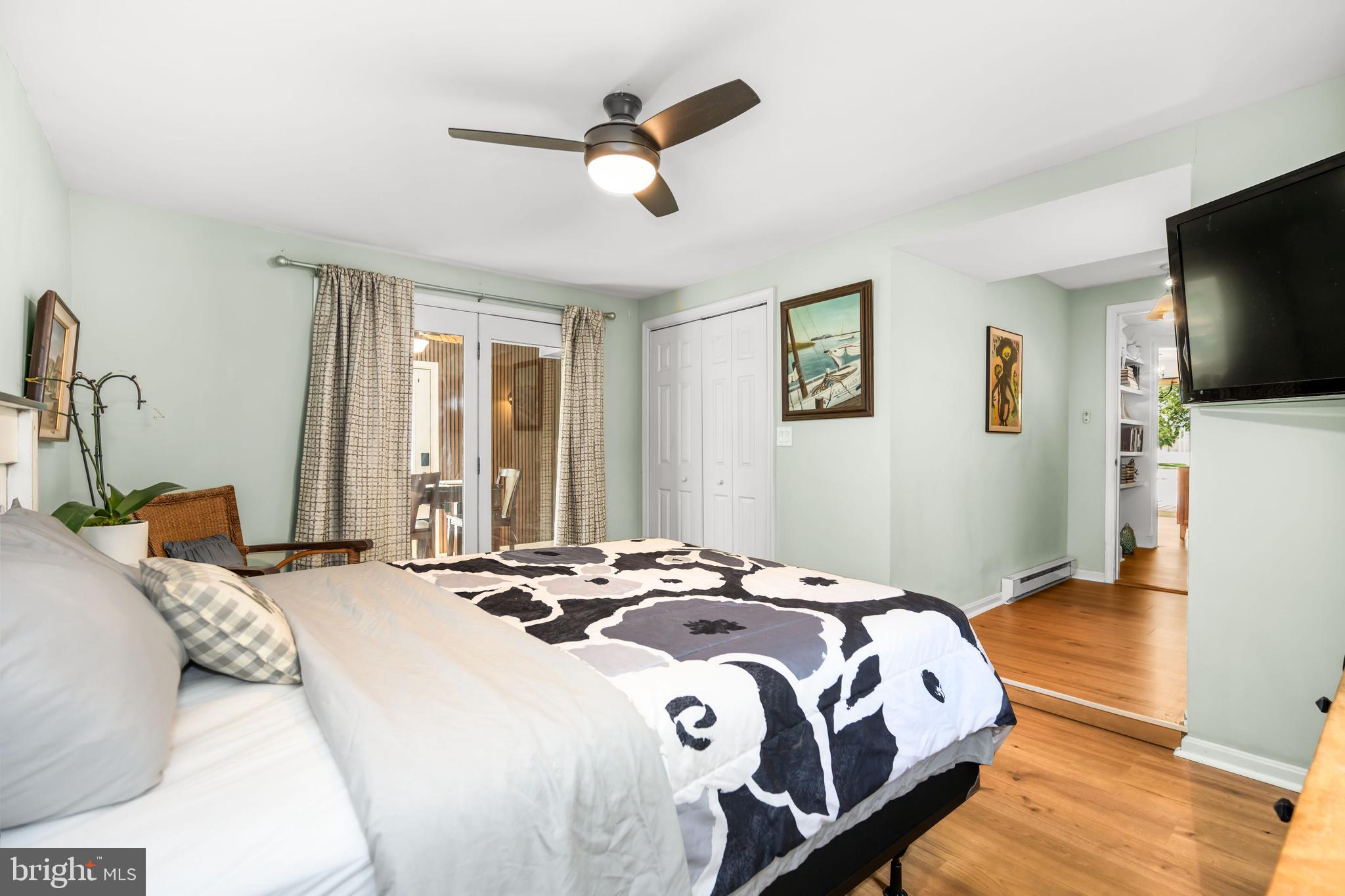 7653 Broad Neck Road Chestertown, MD 21620 - Photo 31 of 39 a bedroom with a bed and a flat screen tv