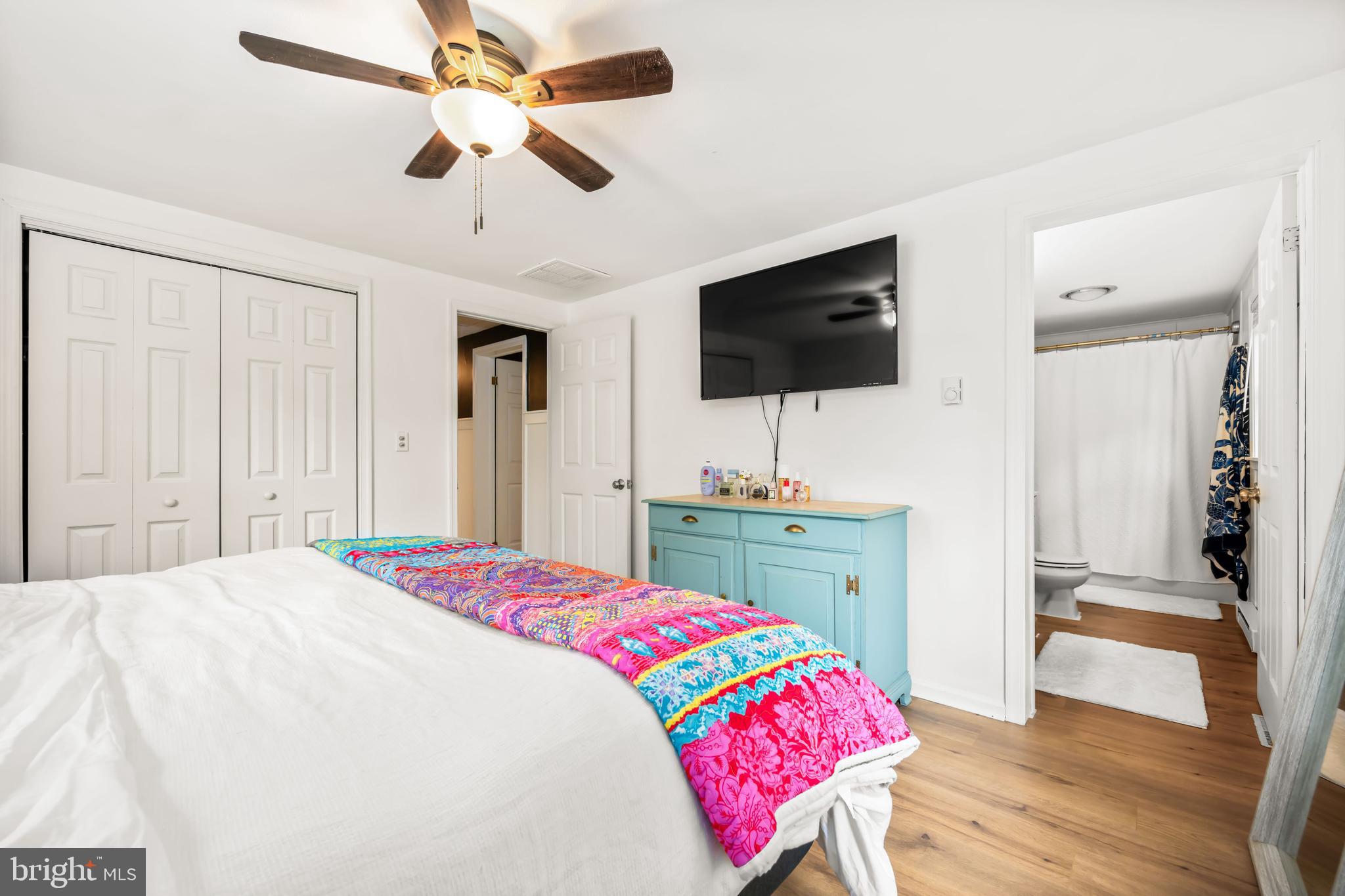 7653 Broad Neck Road Chestertown, MD 21620 - Photo 36 of 39 a bedroom with a bed and a flat screen tv