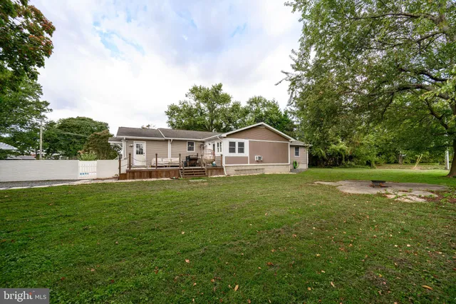 a house view with outdoor space and garden
