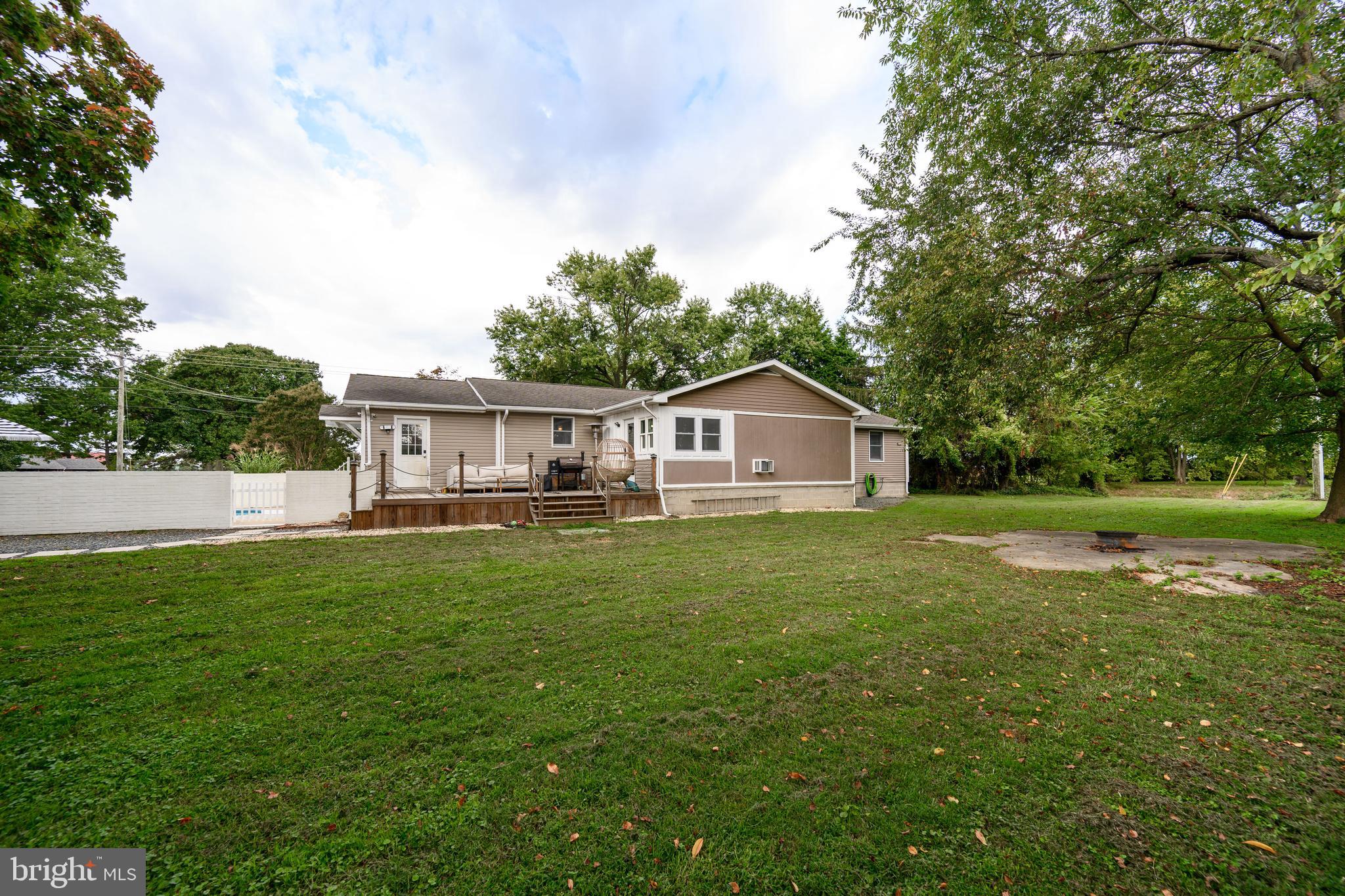 7653 Broad Neck Road Chestertown, MD 21620 - Photo 7 of 39 a front view of a house with yard and green space