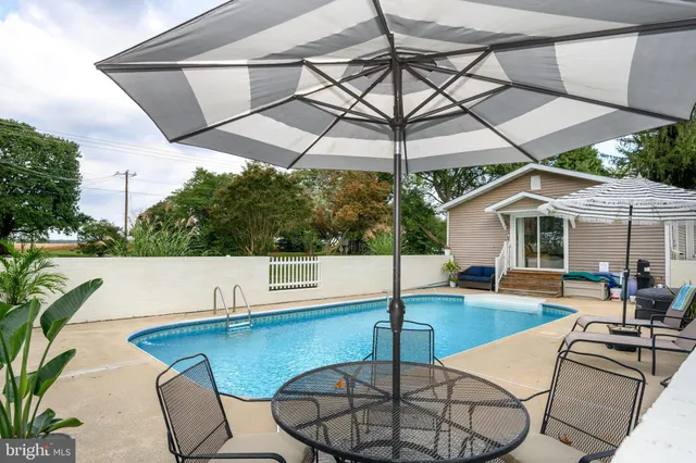 a view of swimming pool with outdoor seating