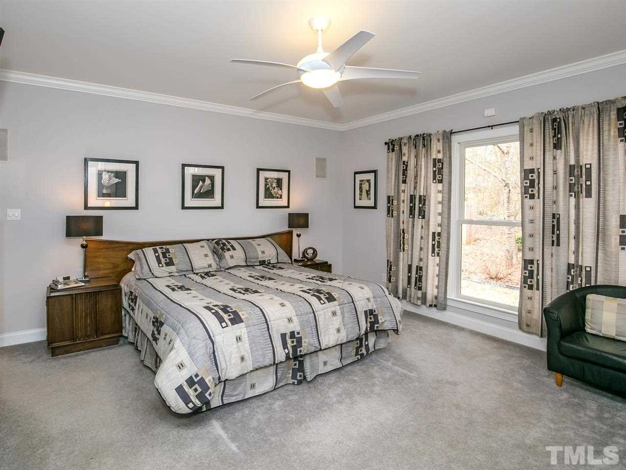 1832 Stannard Trail Raleigh, NC 27612 - Photo 10 of 25 Master Bedroom features a wall of windows and an ensuite bath. Master Bedroom