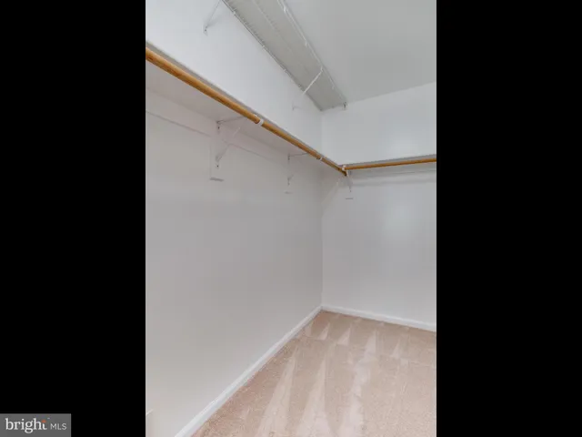 a bathroom with a double vanity sink window and a mirror