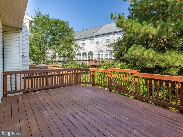 a view of a balcony with wooden floor