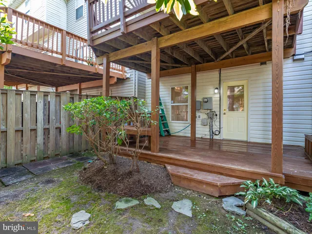 a house with a flower garden in front of it