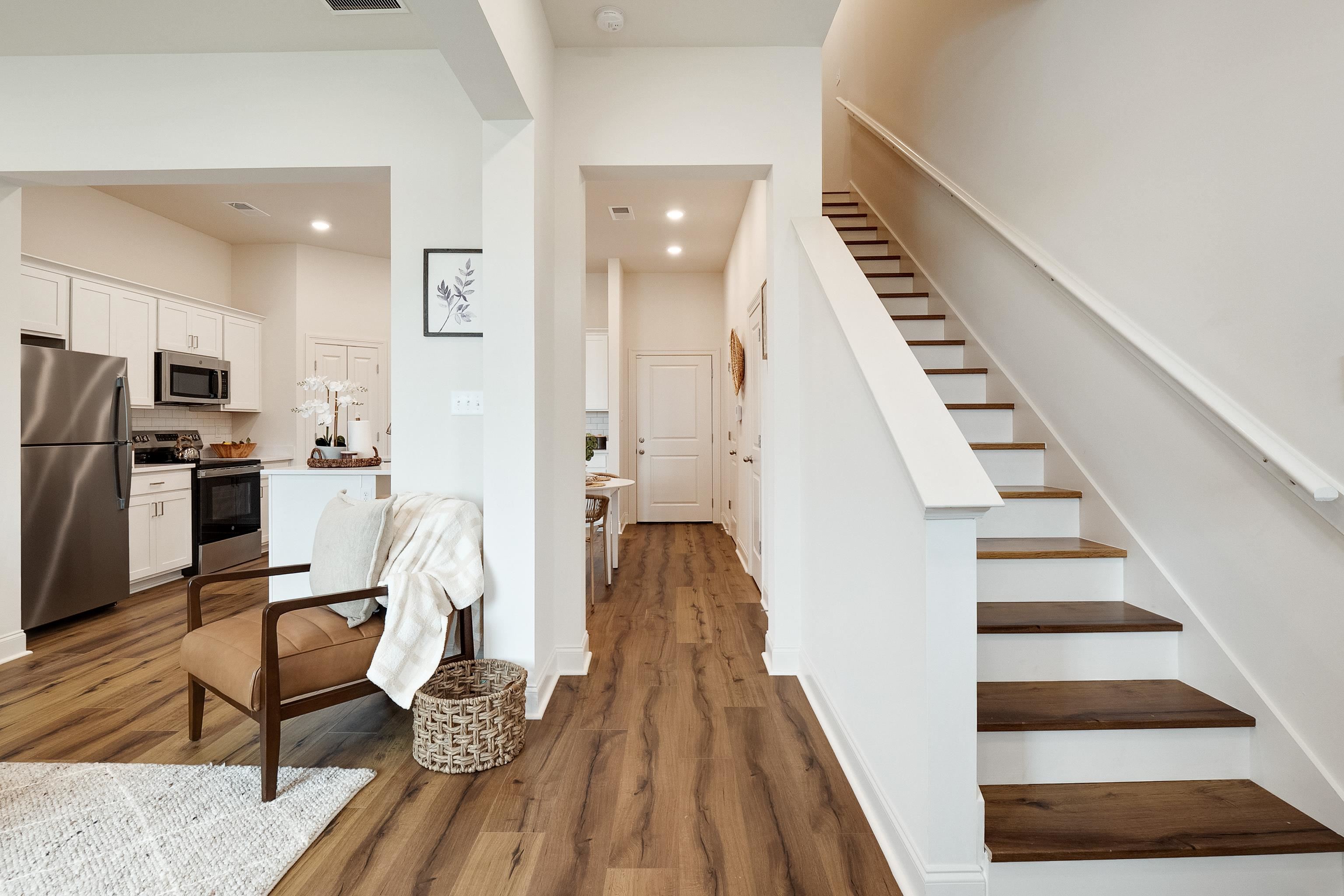 4793 South Houston Levee Road Collierville, TN 38017 - Photo 12 of 20 a view of a living room with furniture and wooden floor