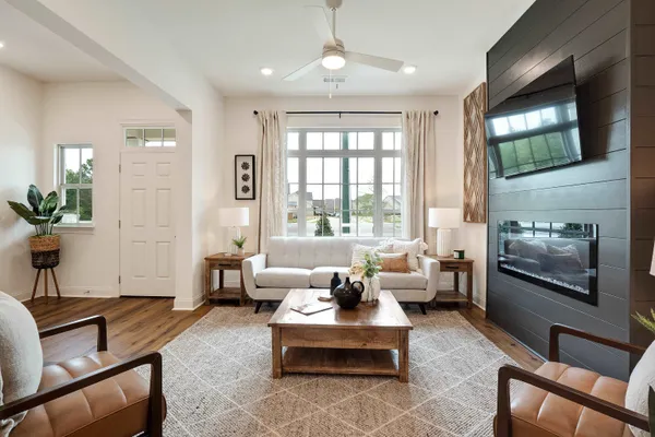 a living room with furniture and a flat screen tv