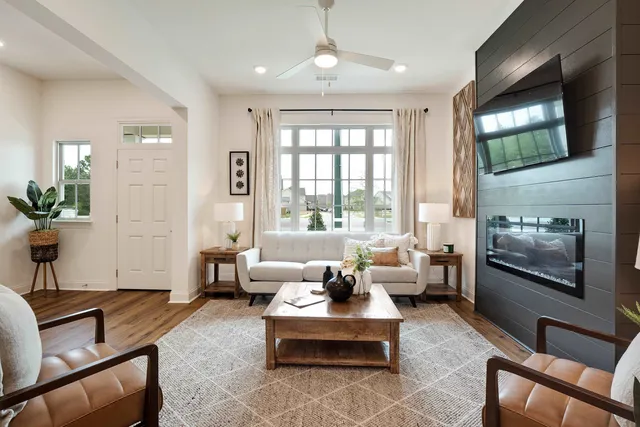 a living room with furniture and a flat screen tv