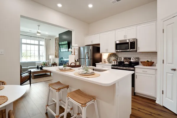 a kitchen with a dining table and chairs