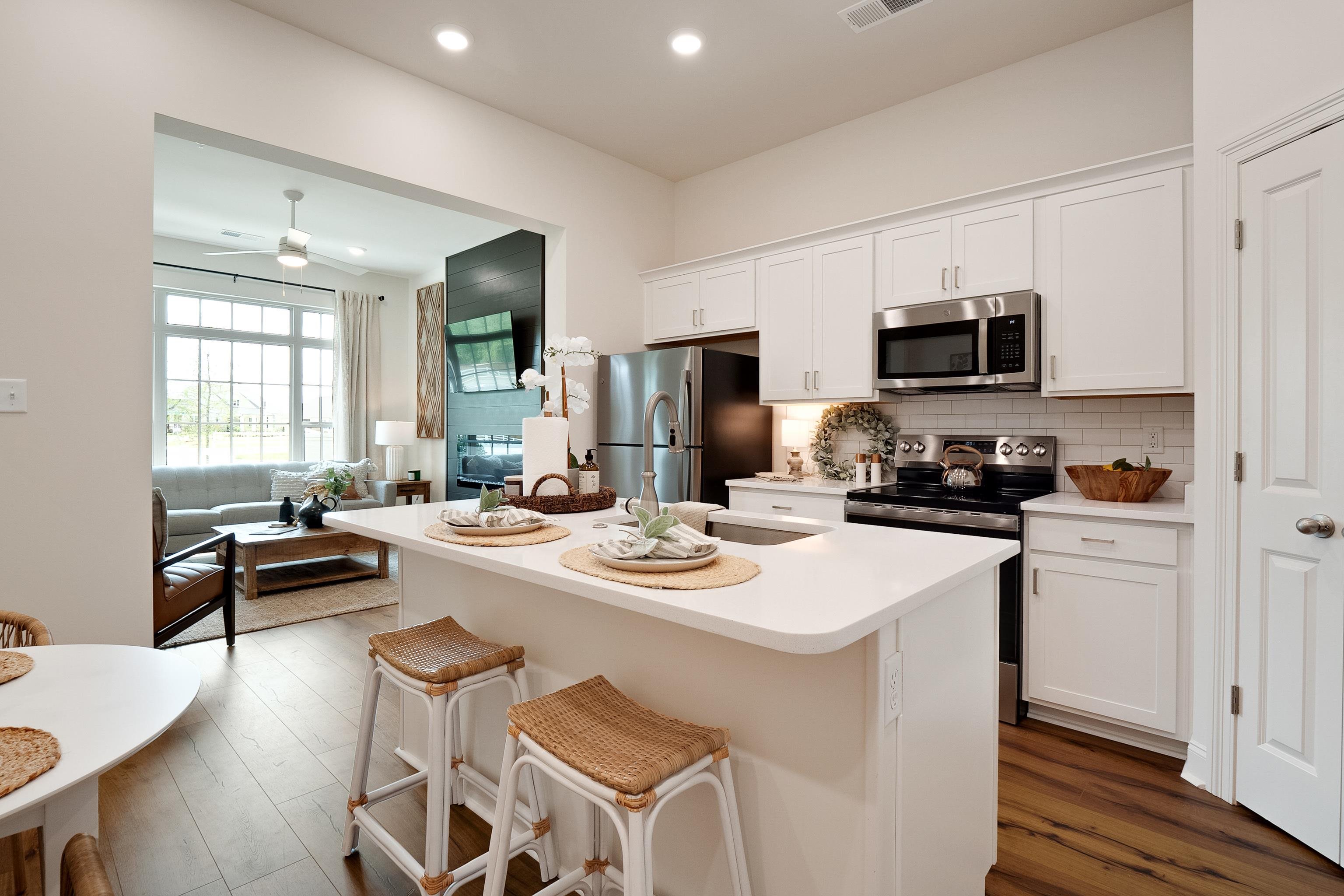4793 South Houston Levee Road Collierville, TN 38017 - Photo 6 of 20 a kitchen with a dining table and chairs