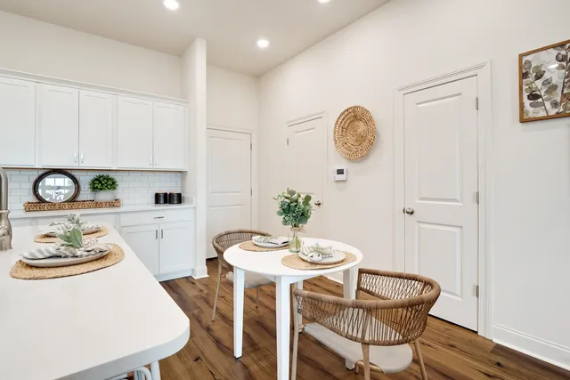 a view of a dining room with furniture window and wooden floor