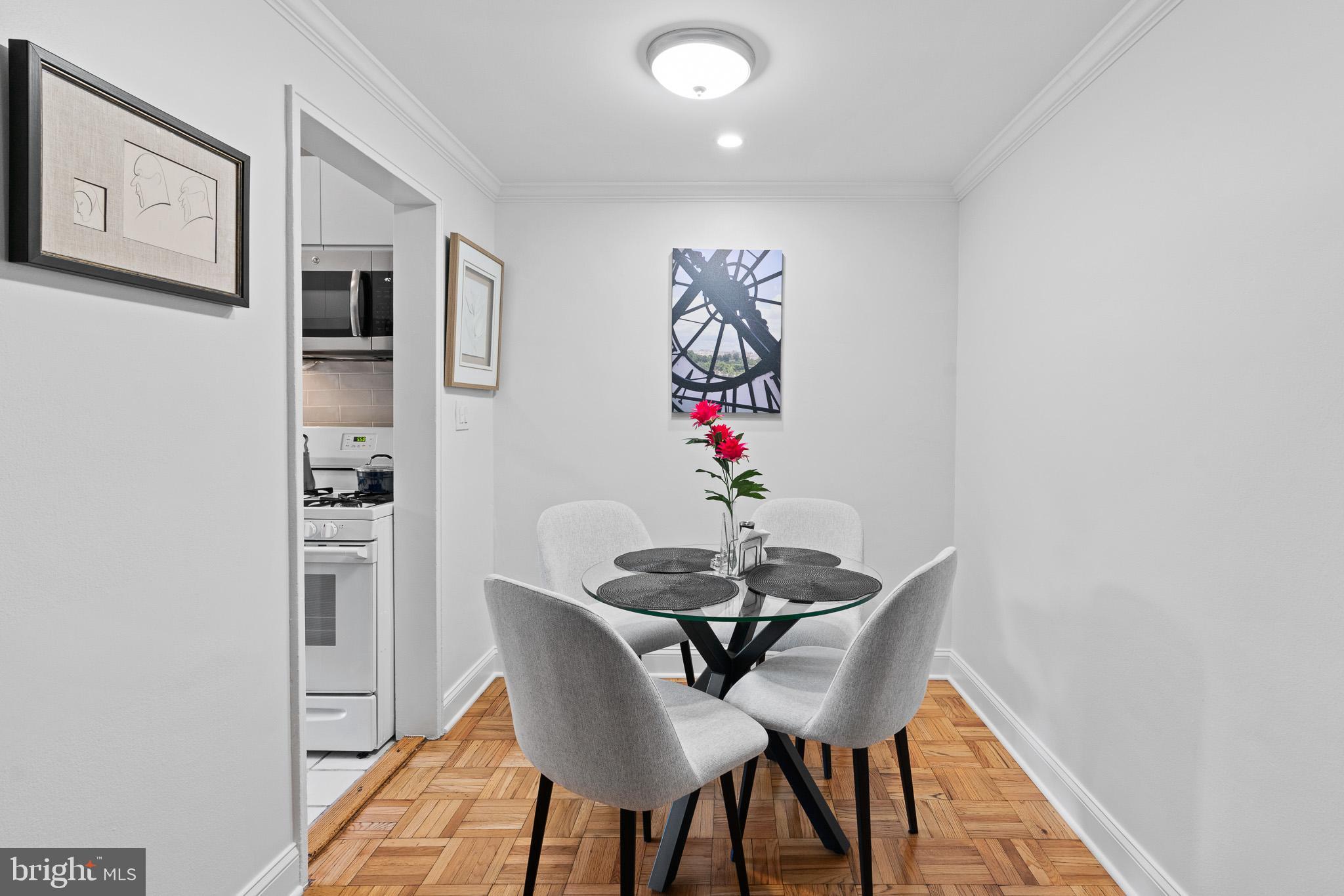 3901 Tunlaw Road Northwest, Unit 506 Washington, DC 20007 - Photo 5 of 21 a view of a dining room with furniture