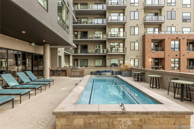 a view of pool with outdoor seating