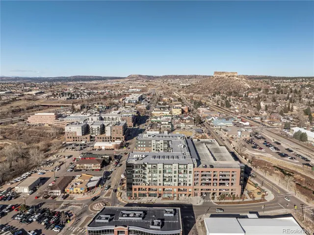 an aerial view of residential building and parking space