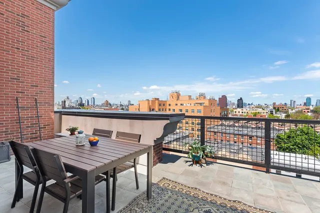 a living room with furniture and a book shelf