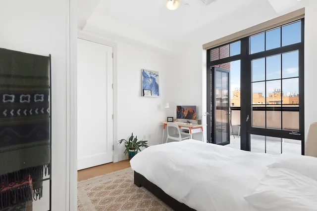 a view of a chairs and table in a balcony