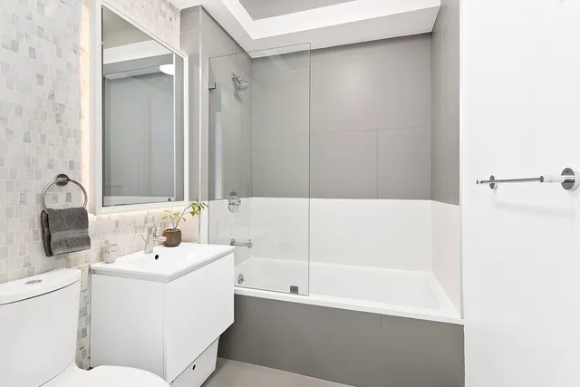 a bedroom with a large bed and a tv