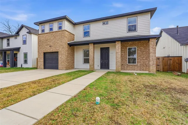 a view of a brick house with a large windows