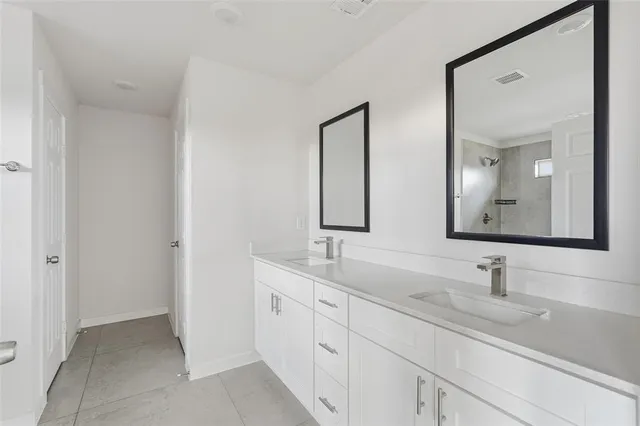 a view of a kitchen with wooden floor and a refrigerator