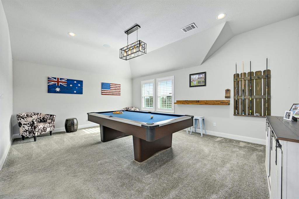 629 Germander Road Leander, TX 78641 - Photo 20 of 32 A vibrant recreation room with a pool table and abundant natural light invites spirited entertainment.