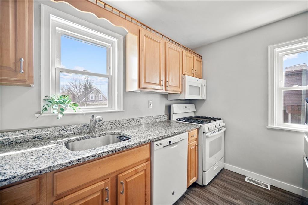 416 Phillips Avenue McKees Rocks, PA 15136 - Photo 15 of 46 a kitchen with stainless steel appliances granite countertop a sink stove and cabinets