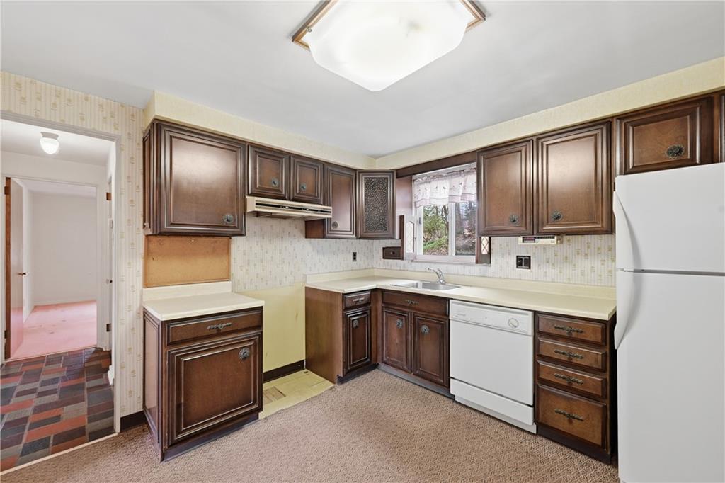 824 Vilsack Road Glenshaw, PA 15116 - Photo 14 of 44 a kitchen with cabinets a sink and stainless steel appliances