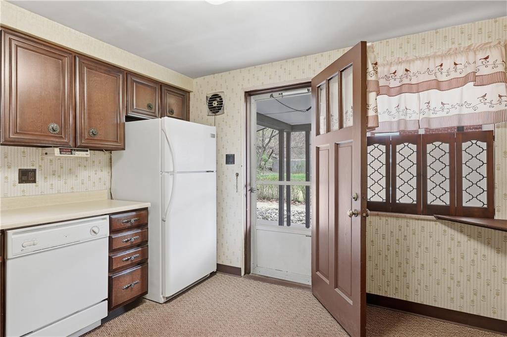 824 Vilsack Road Glenshaw, PA 15116 - Photo 16 of 44 a kitchen with stainless steel appliances granite countertop a refrigerator and a stove top oven