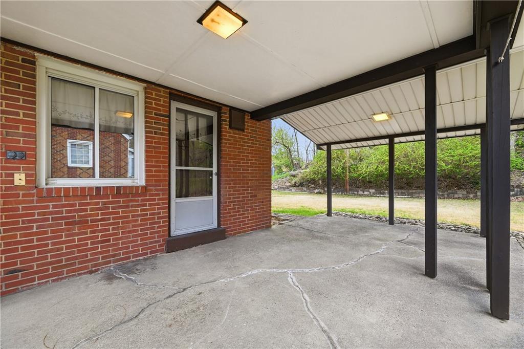 824 Vilsack Road Glenshaw, PA 15116 - Photo 17 of 44 a view of an empty room with a floor to ceiling window and an entryway