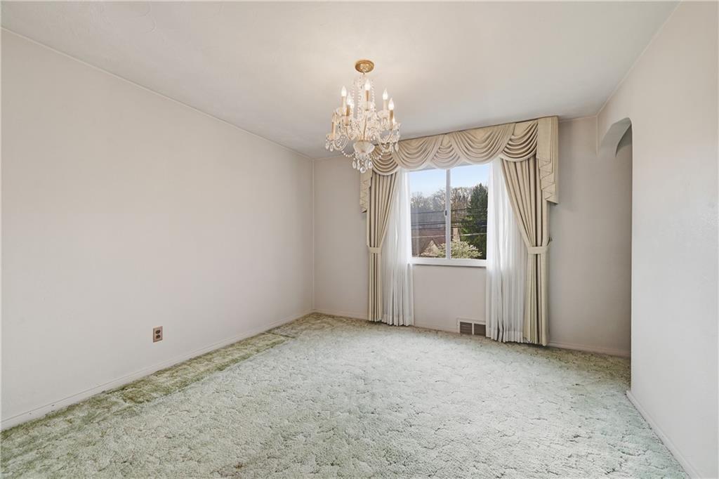 824 Vilsack Road Glenshaw, PA 15116 - Photo 20 of 44 a view of an empty room with a window