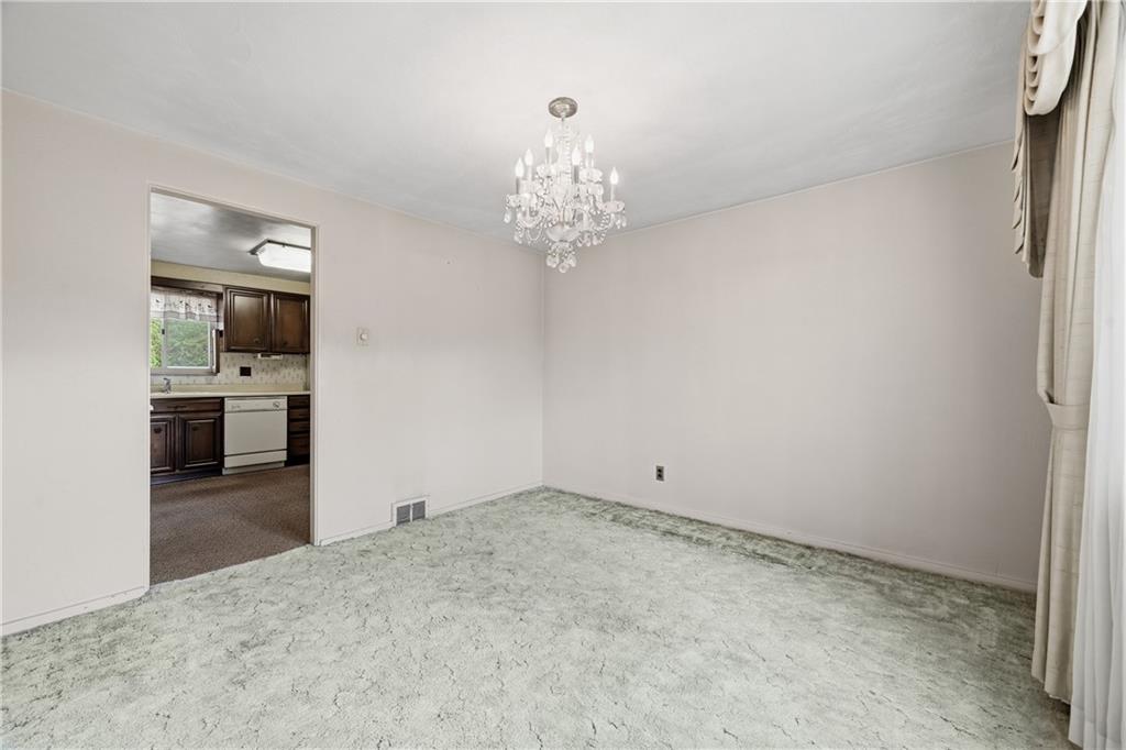 824 Vilsack Road Glenshaw, PA 15116 - Photo 21 of 44 a view of an empty room with a kitchen